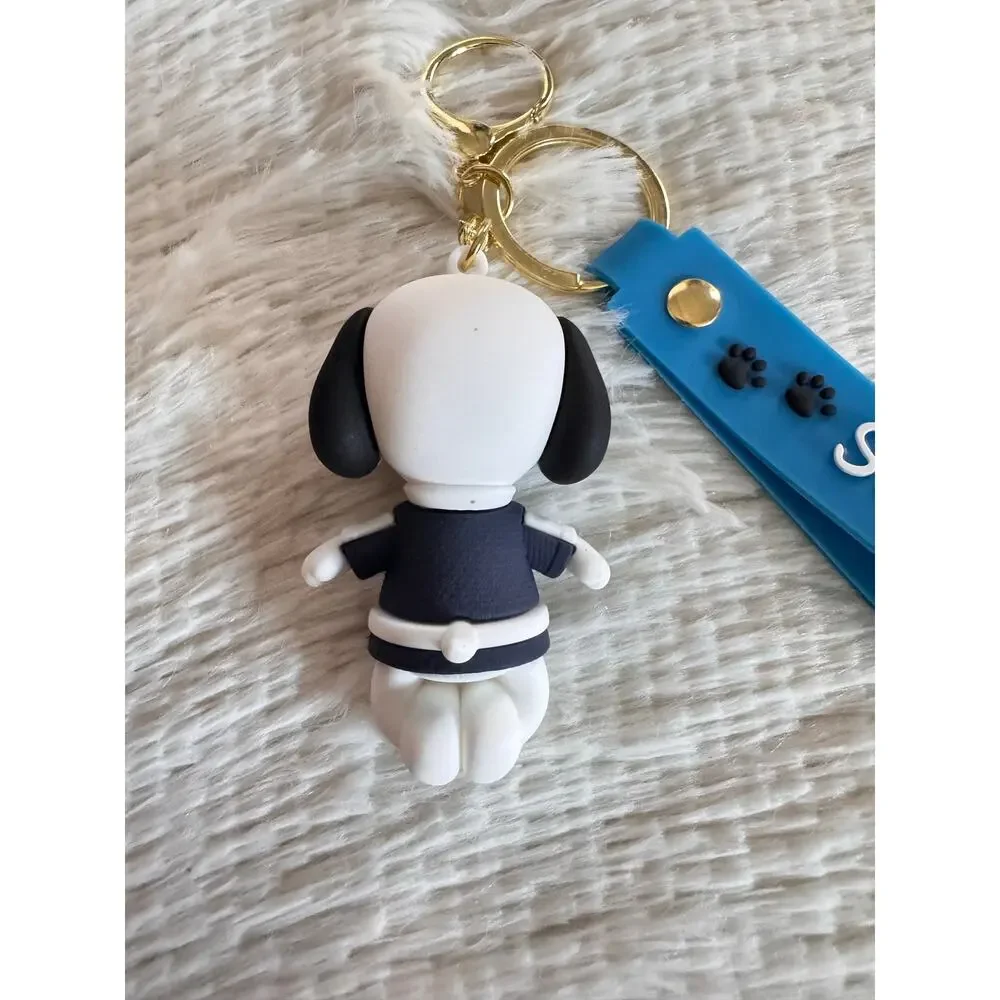 Snoopy with sweater keychain blue strap featuring white text and Snoopy graphic